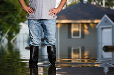 man-standing-in-flood-water